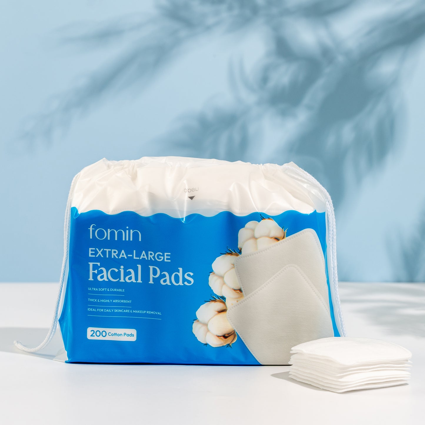 Pack of fomin Extra-Large Facial Pads with a blue label on a light background